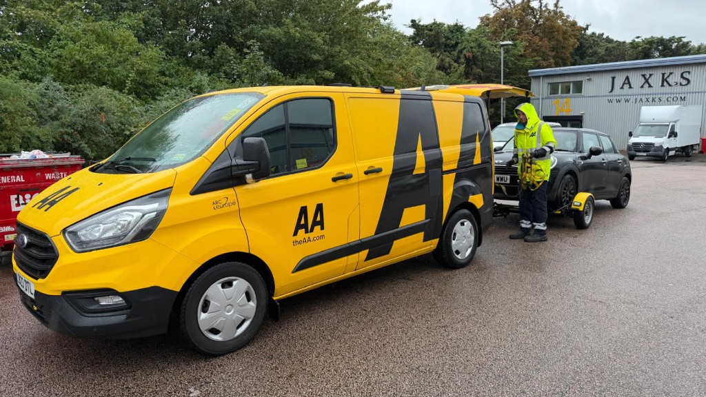 AA recovery van delivering a car to A & B Motors