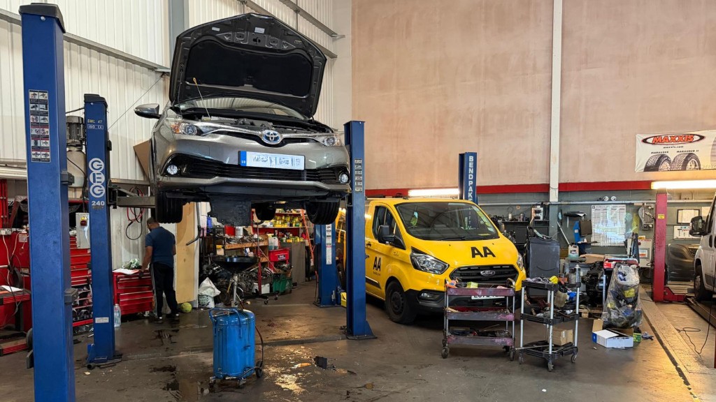 Car on the ramp in the A & B Motors workshop